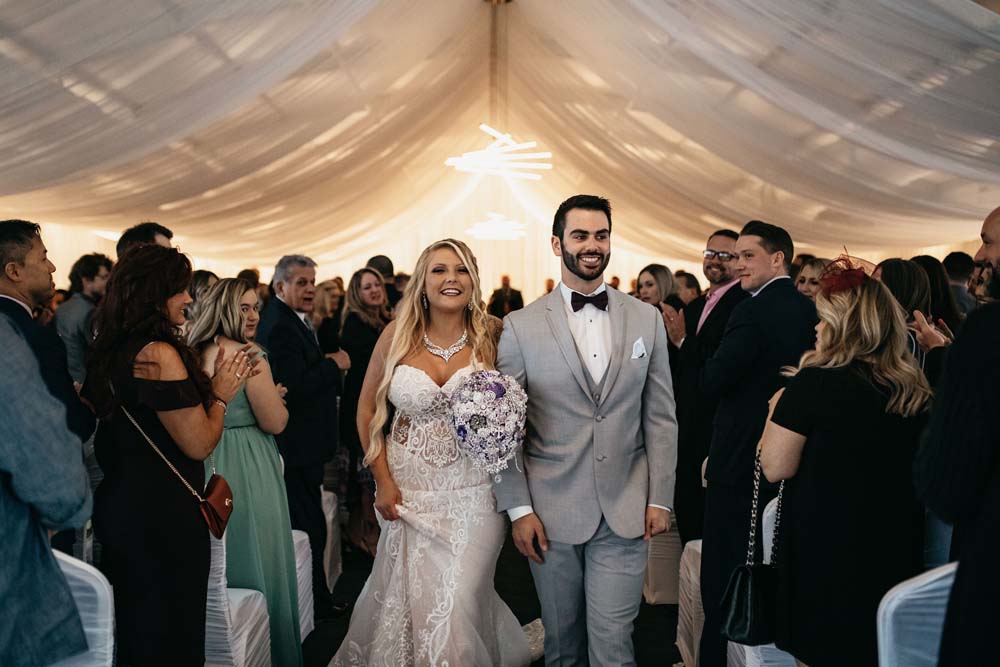 Bride and Groom Walking Down the Aisle