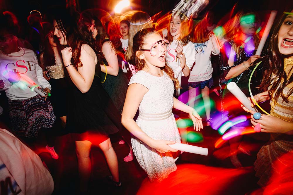 a room full of tables and chairs for wedding reception