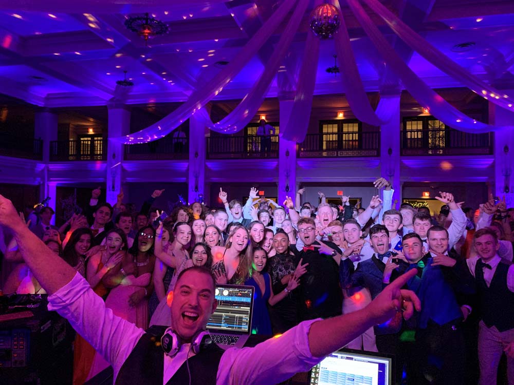 Professional DJ serving as MC at a Dayton school homecoming dance